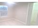 Well-lit bedroom featuring ceiling fan and walk-in closet at 940 Village Trl # 8-101, Port Orange, FL 32127