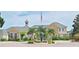 Elegant community clubhouse with fountain and landscaping at 940 Village Trl # 8-101, Port Orange, FL 32127