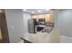 Modern kitchen with stainless steel appliances and light wood cabinets at 940 Village Trl # 8-101, Port Orange, FL 32127