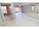 Bright and airy living room with tile floors and access to patio at 940 Village Trl # 8-101, Port Orange, FL 32127