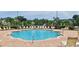 Community pool with plenty of lounge chairs for relaxation at 940 Village Trl # 8-101, Port Orange, FL 32127