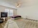 Spacious bedroom with large window and ceiling fan at 1059 Ronlin St, Haines City, FL 33844