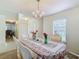 Bright dining room with a chandelier, table, chairs, and built-in hutch at 1059 Ronlin St, Haines City, FL 33844