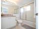 Bathroom with shower/tub combo, toilet, and vanity with white cabinets at 1065 Park Ridge Cir, Kissimmee, FL 34746