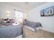 Mickey Mouse themed bedroom with twin beds, TV, and cheerful decor at 1065 Park Ridge Cir, Kissimmee, FL 34746
