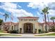 Community clubhouse with inviting entrance and landscaping at 1065 Park Ridge Cir, Kissimmee, FL 34746