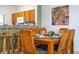 Dining area with wood table and chairs, adjacent to kitchen at 1065 Park Ridge Cir, Kissimmee, FL 34746