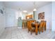 Dining area with wood table and chairs, adjacent to kitchen at 1065 Park Ridge Cir, Kissimmee, FL 34746
