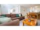 Living room with brown sectional sofa and wooden coffee table at 1065 Park Ridge Cir, Kissimmee, FL 34746