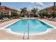 Resort-style pool with lounge chairs and surrounding buildings at 1065 Park Ridge Cir, Kissimmee, FL 34746