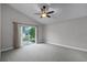 Bedroom with sliding glass door to patio at 10821 Oak Glen Cir, Orlando, FL 32817