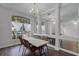 Dining area with mirrored wall and neutral color scheme at 10821 Oak Glen Cir, Orlando, FL 32817