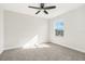 Bright bedroom with ceiling fan and neutral carpeting at 11641 Fiction Ave, Orlando, FL 32832