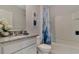 Clean bathroom with granite countertop and a shower/tub combo at 1185 Alstonia Ln, Mount Dora, FL 32757