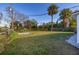 Large backyard with grassy area and privacy fence at 128 Academy Ave, Sanford, FL 32771