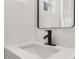 Modern bathroom with white sink and black faucet at 128 Academy Ave, Sanford, FL 32771