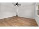 Bright bedroom with wood floors and ample closet space at 128 Academy Ave, Sanford, FL 32771
