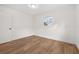 Spacious bedroom with light walls and wood-look floors at 128 Academy Ave, Sanford, FL 32771