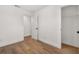 Empty bedroom with wood-look floors and neutral walls at 128 Academy Ave, Sanford, FL 32771