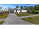 Newly renovated house with a carport and a spacious front yard at 128 Academy Ave, Sanford, FL 32771