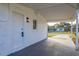 White front porch with covered entryway and view of street at 128 Academy Ave, Sanford, FL 32771