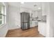 Modern kitchen with stainless steel appliances and white cabinets at 128 Academy Ave, Sanford, FL 32771