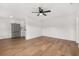 Spacious living room with hardwood floors and ceiling fan at 128 Academy Ave, Sanford, FL 32771