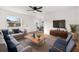 Bright living room with hardwood floors and modern furniture at 128 Academy Ave, Sanford, FL 32771