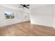 Spacious living room with hardwood floors and ceiling fan at 128 Academy Ave, Sanford, FL 32771