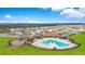 Community pool, playground, and homes with lake view at 14352 Noto Ave, Clermont, FL 34714