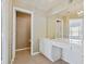 Primary bathroom with double vanity and walk-in closet at 15007 Bellinkoff Ln, Orlando, FL 32828