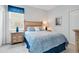 Guest bedroom with a double bed and light blue bedding at 15886 Citrus Grove Loop, Winter Garden, FL 34787