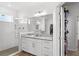 Bathroom with shower, vanity, and linen closet at 16719 Sanctuary Dr, Winter Garden, FL 34787