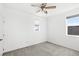 Spacious bedroom with two windows and ceiling fan at 16719 Sanctuary Dr, Winter Garden, FL 34787
