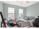 Bedroom with bed and large windows with backyard view at 16719 Sanctuary Dr, Winter Garden, FL 34787