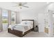 Bright bedroom with window and ensuite bathroom access at 16719 Sanctuary Dr, Winter Garden, FL 34787