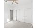 Bright bedroom with double door closet and carpet flooring at 16719 Sanctuary Dr, Winter Garden, FL 34787