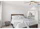 Spacious bedroom with a wooden bed frame and ensuite bathroom access at 16719 Sanctuary Dr, Winter Garden, FL 34787
