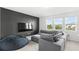 Bonus room with sectional sofa, large TV and bean bag chair at 16719 Sanctuary Dr, Winter Garden, FL 34787