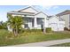 Two-story house with palm trees and landscaping at 16719 Sanctuary Dr, Winter Garden, FL 34787