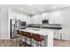 Modern kitchen with white cabinets, stainless steel appliances, and an island at 16719 Sanctuary Dr, Winter Garden, FL 34787