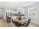 Modern kitchen with island and round dining table at 16719 Sanctuary Dr, Winter Garden, FL 34787