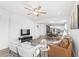Bright living room with open floor plan and a view into the kitchen at 16719 Sanctuary Dr, Winter Garden, FL 34787