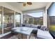 Relaxing screened porch with seating and fire pit at 16719 Sanctuary Dr, Winter Garden, FL 34787