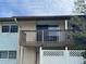 Private balcony with wooden railing and fence at 1695 Lee Rd # B211, Winter Park, FL 32789