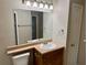Bathroom with vanity, mirror, and light fixtures at 1695 Lee Rd # B211, Winter Park, FL 32789