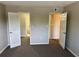 Bedroom with doors leading to another room and bathroom at 1695 Lee Rd # B211, Winter Park, FL 32789