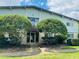 Charming condo building with mature trees and manicured landscaping at 1695 Lee Rd # B211, Winter Park, FL 32789