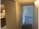 Hallway with access to kitchen and living room at 1695 Lee Rd # B211, Winter Park, FL 32789