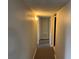 Hallway with carpeted floors and neutral walls at 1695 Lee Rd # B211, Winter Park, FL 32789
